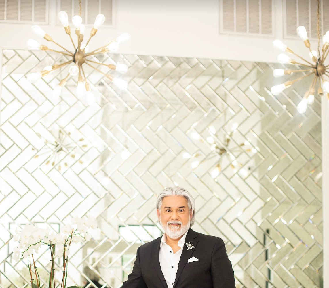 White marble island, herringbone mirror wall, sputnik chandeliers